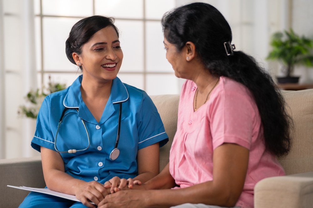 Side,View,Shot,Of,Happy,Indian,Nurse,With,Talking,With